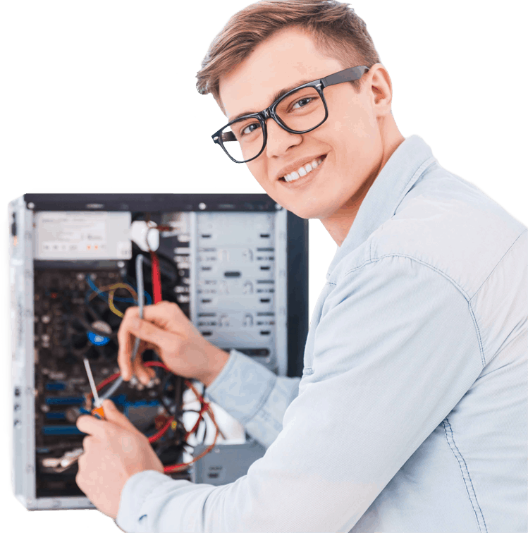 young-man-smiles-wearing-geeky-eyeglasses-wiring a desktop-tower